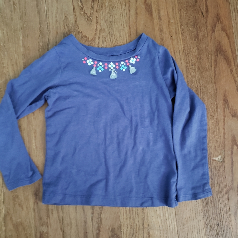Purple long sleeve shirt with silver tassels